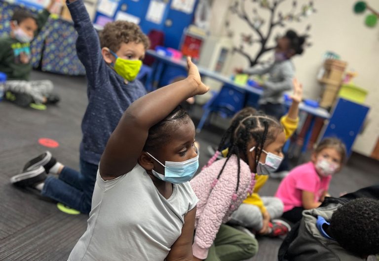 ocoee oaks preschool children raising their hands