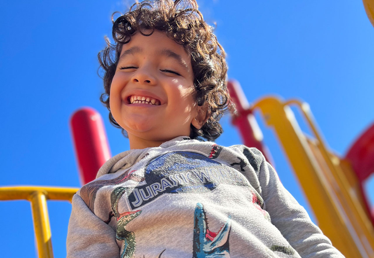 ocoee oaks preschool little boy with closed eyed smile