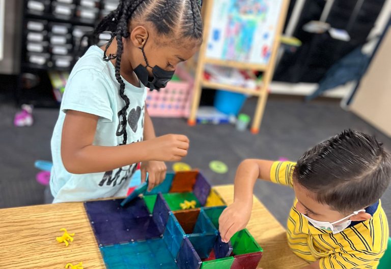 ocoee oaks preschool two kids building with puzzle squares