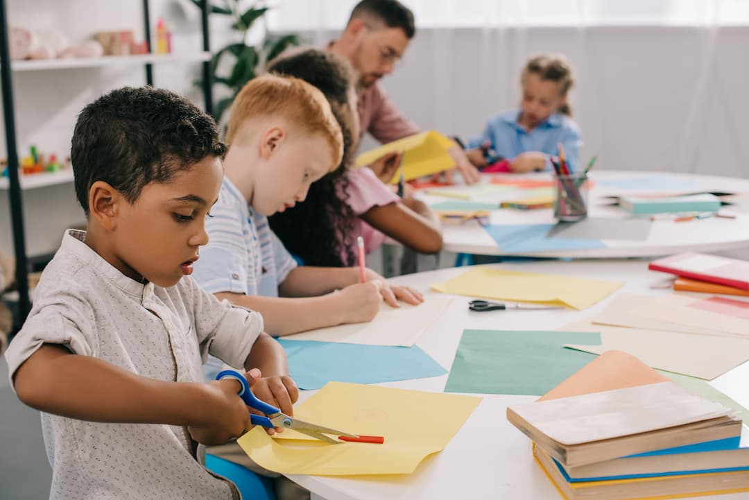 some kids working on crafts